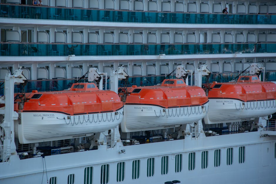 Close-up view of lifeboats on a cruise ship, highlighting safety equipment.